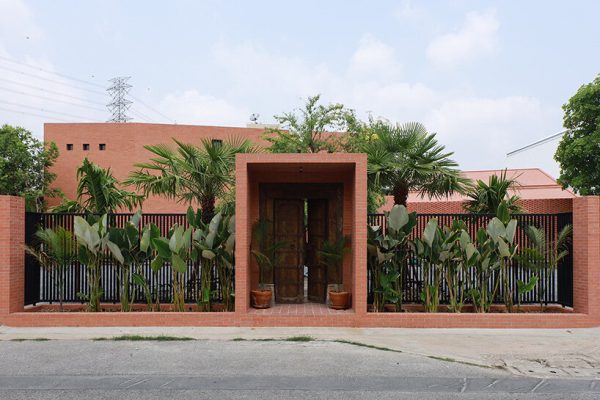 curved brick wall envelops volume matrix studio’s multi-functional art space in bangkok