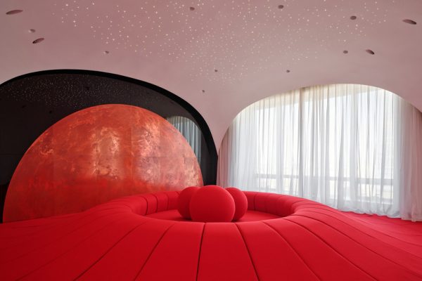 copper planet installation and red undulating seating anchor venus lounge by asap/ in beijing
