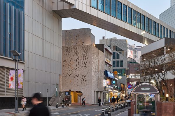 perforated brickwork forms pixelated pattern upon restored seoul building by NOMAL